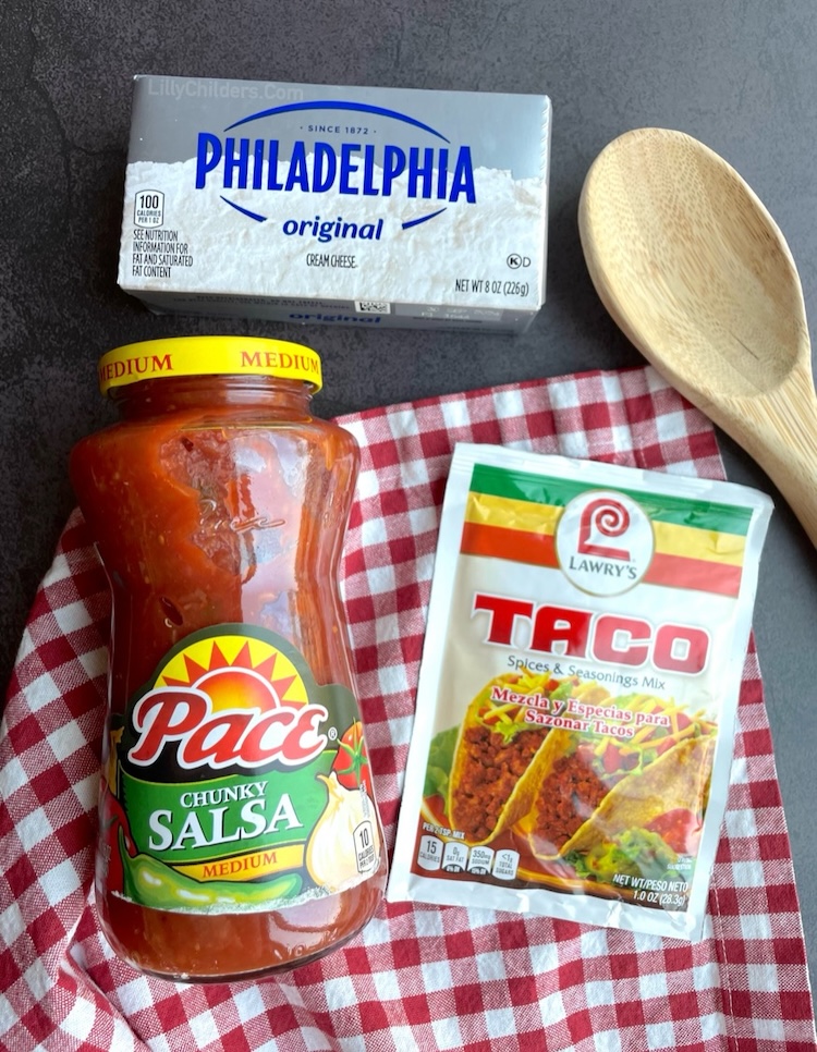 How to make slow cooker shredded chicken tacos with a block of cream cheese, a jar of salsa, and a packet of taco seasoning. 