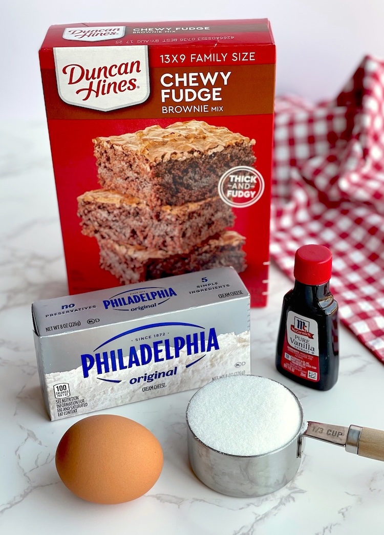 how to make cheesecake swirled brownies with store bought brownie mix and cream cheese. An impressive homemade dessert that's super easy to make with just a few basic ingredients!