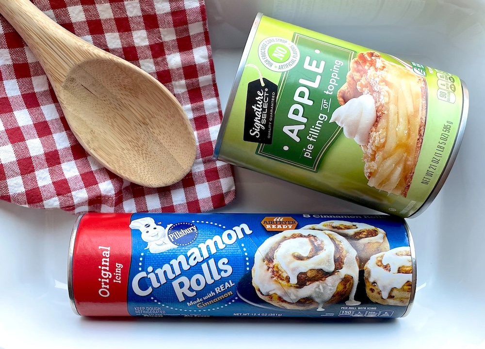 Cinnamon Roll Apple Pie Filling Cobbler made with just 2 ingredients including Pillsbury Cinnamon Rolls and a can of apple pie filling. Wonderful served as a dessert with ice cream or as a sweet breakfast on special occasions.